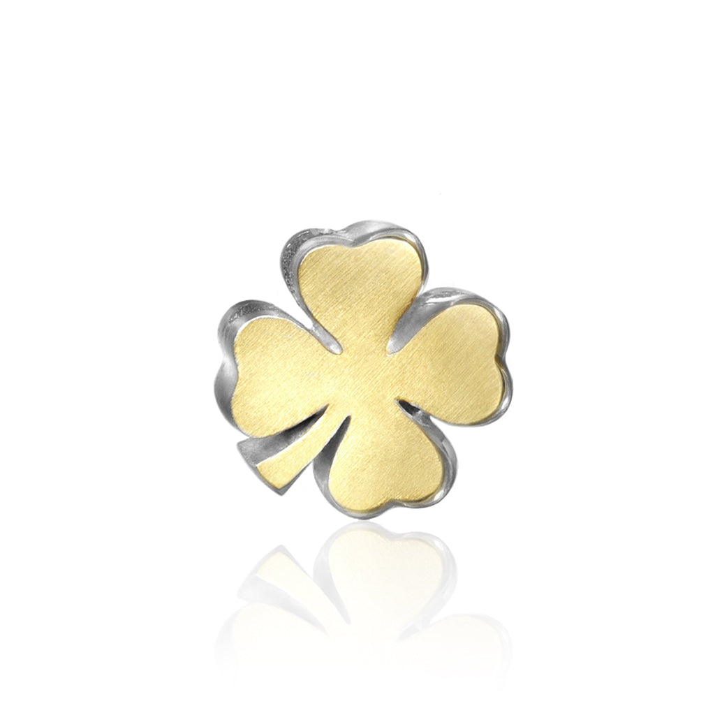 Four leaf clover charm necklace in gold and sterling silver with smooth beveled leaves and delicate sculpted shape.